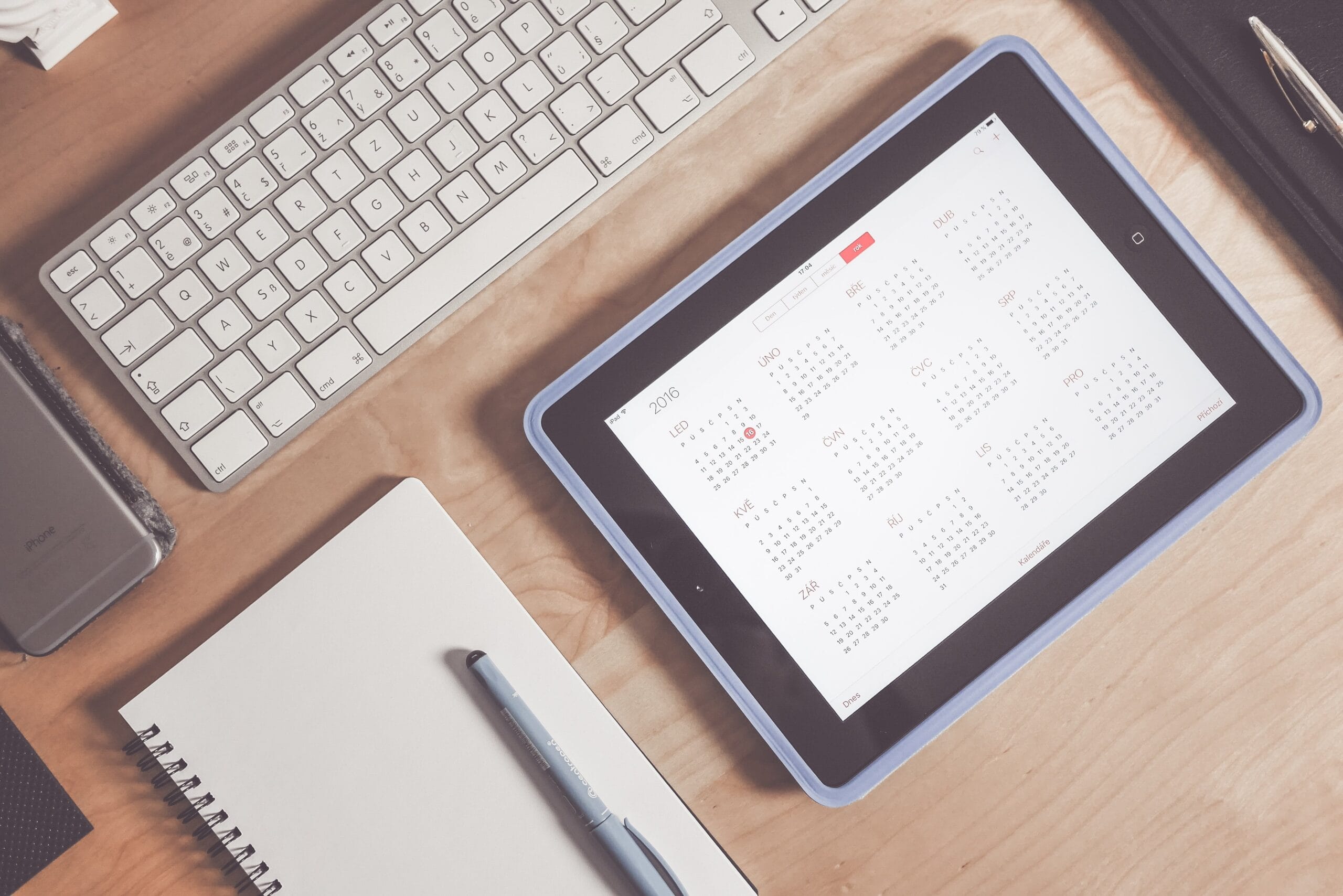 Virtual admin assistance services — A tablet on an office desk, displaying calendar for the year, thus showcasing the importance of calendar management.